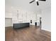 Modern kitchen with dark lower cabinets, white upper cabinets, and large island at 4002 Moody Ln, Woodstock, GA 30188