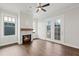 Cozy living room with hardwood floors, fireplace, and access to a deck at 4002 Moody Ln, Woodstock, GA 30188
