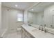 Elegant bathroom with double vanity, large mirror, and subway tile at 5361 Seaton Way, Dunwoody, GA 30338