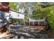 View of the home's backyard with detached structure and driveway at 1225 Clifton Rd, Atlanta, GA 30307