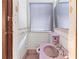 Small bathroom with pink sink, toilet, and white tile; needs updating at 1225 Clifton Rd, Atlanta, GA 30307