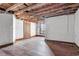Spacious bedroom with hardwood floors and exposed beams, ready for renovation at 1225 Clifton Rd, Atlanta, GA 30307