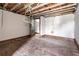 Large bedroom with hardwood floors and exposed beams, ready for renovation at 1225 Clifton Rd, Atlanta, GA 30307