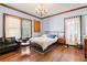 Bedroom with hardwood floors, a bed, and a sitting area at 1225 Clifton Rd, Atlanta, GA 30307