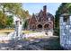 Brick home with stone pillars and a long driveway at 1225 Clifton Rd, Atlanta, GA 30307