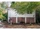 Detached garage with three garage doors and a small yard at 1225 Clifton Rd, Atlanta, GA 30307