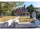 Two-story brick home with a walkway leading to a charming front porch at 1225 Clifton Rd, Atlanta, GA 30307