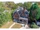 Brick house with a large front porch and stone retaining wall at 1225 Clifton Rd, Atlanta, GA 30307