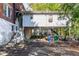 Rear view of the house with a detached garage and access at 1225 Clifton Rd, Atlanta, GA 30307