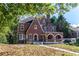 Front view of a charming brick house with landscaping at 1225 Clifton Rd, Atlanta, GA 30307