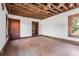 Spacious room with hardwood floors, exposed beams, and original woodwork at 1225 Clifton Rd, Atlanta, GA 30307