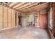Empty interior room with exposed beams, hardwood floors, and original woodwork at 1225 Clifton Rd, Atlanta, GA 30307