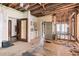 Renovation in progress: Kitchen with exposed framing, new refrigerator, and tiled floor at 1225 Clifton Rd, Atlanta, GA 30307