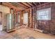 Kitchen under renovation, showing exposed walls and new refrigerator at 1225 Clifton Rd, Atlanta, GA 30307