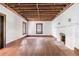 Living room with hardwood floors, exposed beams, and a fireplace at 1225 Clifton Rd, Atlanta, GA 30307