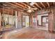 A living room undergoing renovation, showing exposed beams and hardwood floors at 1225 Clifton Rd, Atlanta, GA 30307