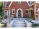 Front porch detail with arched entryway and brick columns at 1225 Clifton Rd, Atlanta, GA 30307