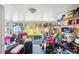 Sunroom with outdoor access and storage shelving at 2634 Beaver Creek Xing, Powder Springs, GA 30127