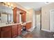 Elegant bathroom with double vanity, custom cabinetry, and slate tile floors at 4345 Chesterfield Ct, Buford, GA 30518