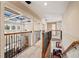 Upstairs hallway with high ceilings and a view of the living room at 4345 Chesterfield Ct, Buford, GA 30518