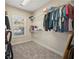 Spacious walk-in closet with ample shelving and hanging rods at 4345 Chesterfield Ct, Buford, GA 30518