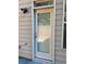 Exterior back door with blinds and security light at 5671 Radford Loop, Fairburn, GA 30213