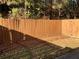 Small backyard with wooden privacy fence at 5671 Radford Loop, Fairburn, GA 30213