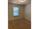 Bright bedroom featuring carpet and a window at 5671 Radford Loop, Fairburn, GA 30213
