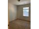 Simple bedroom with carpet and window blinds at 5671 Radford Loop, Fairburn, GA 30213