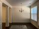 Bright dining room with hardwood floors and chandelier at 5671 Radford Loop, Fairburn, GA 30213