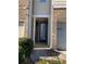 Front entry with brick and neutral siding at 5671 Radford Loop, Fairburn, GA 30213
