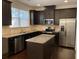 Modern kitchen with stainless steel appliances and granite countertops at 5671 Radford Loop, Fairburn, GA 30213