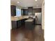 Modern kitchen with stainless steel appliances and granite countertops at 5671 Radford Loop, Fairburn, GA 30213