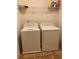 Laundry room with washer, dryer, and shelving at 5671 Radford Loop, Fairburn, GA 30213