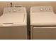 White Whirlpool washer and dryer set in laundry room at 5671 Radford Loop, Fairburn, GA 30213