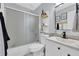 Clean bathroom featuring a shower/tub combo, modern vanity, and stylish decor at 1413 Wilkes Crest Ct, Dacula, GA 30019