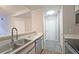 Condo kitchen with stainless steel appliances and white cabinets at 1074 Peachtree Sw Walk # B 216, Atlanta, GA 30303