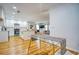 Modern kitchen with white cabinets, island, and hardwood floors at 2230 Beecher Sw Cir, Atlanta, GA 30310