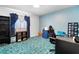 Bedroom with desk, chair, shelving, and blue carpeting at 3632 Glen Mora Dr, Decatur, GA 30032