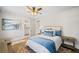 Cozy bedroom with ceiling fan and hardwood floors at 152 Grand Cres, Alpharetta, GA 30009