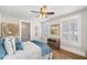Comfortable bedroom with ceiling fan and hardwood floors at 152 Grand Cres, Alpharetta, GA 30009