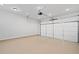 Attached garage with epoxy coated flooring at 152 Grand Cres, Alpharetta, GA 30009
