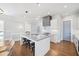 Stylish kitchen featuring white cabinets, a sizable island, and high-end appliances at 152 Grand Cres, Alpharetta, GA 30009