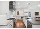 Modern kitchen with stainless steel appliances and light gray countertops at 152 Grand Cres, Alpharetta, GA 30009