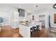 Modern kitchen with white cabinetry, a large island, and stainless steel appliances at 152 Grand Cres, Alpharetta, GA 30009