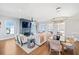 Bright and airy living area with hardwood floors, a dining area, and access to a balcony at 152 Grand Cres, Alpharetta, GA 30009