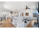 Open living space with hardwood floors, a fireplace, and access to a balcony at 152 Grand Cres, Alpharetta, GA 30009