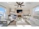 Covered outdoor patio with a built-in kitchen, fireplace, and comfortable seating at 152 Grand Cres, Alpharetta, GA 30009
