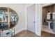 Elegant wet bar with a circular glass display cabinet at 152 Grand Cres, Alpharetta, GA 30009