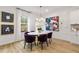 Elegant dining area with oval table, purple chairs, and modern artwork at 204 Sanctuary Dr # 66, Mcdonough, GA 30253